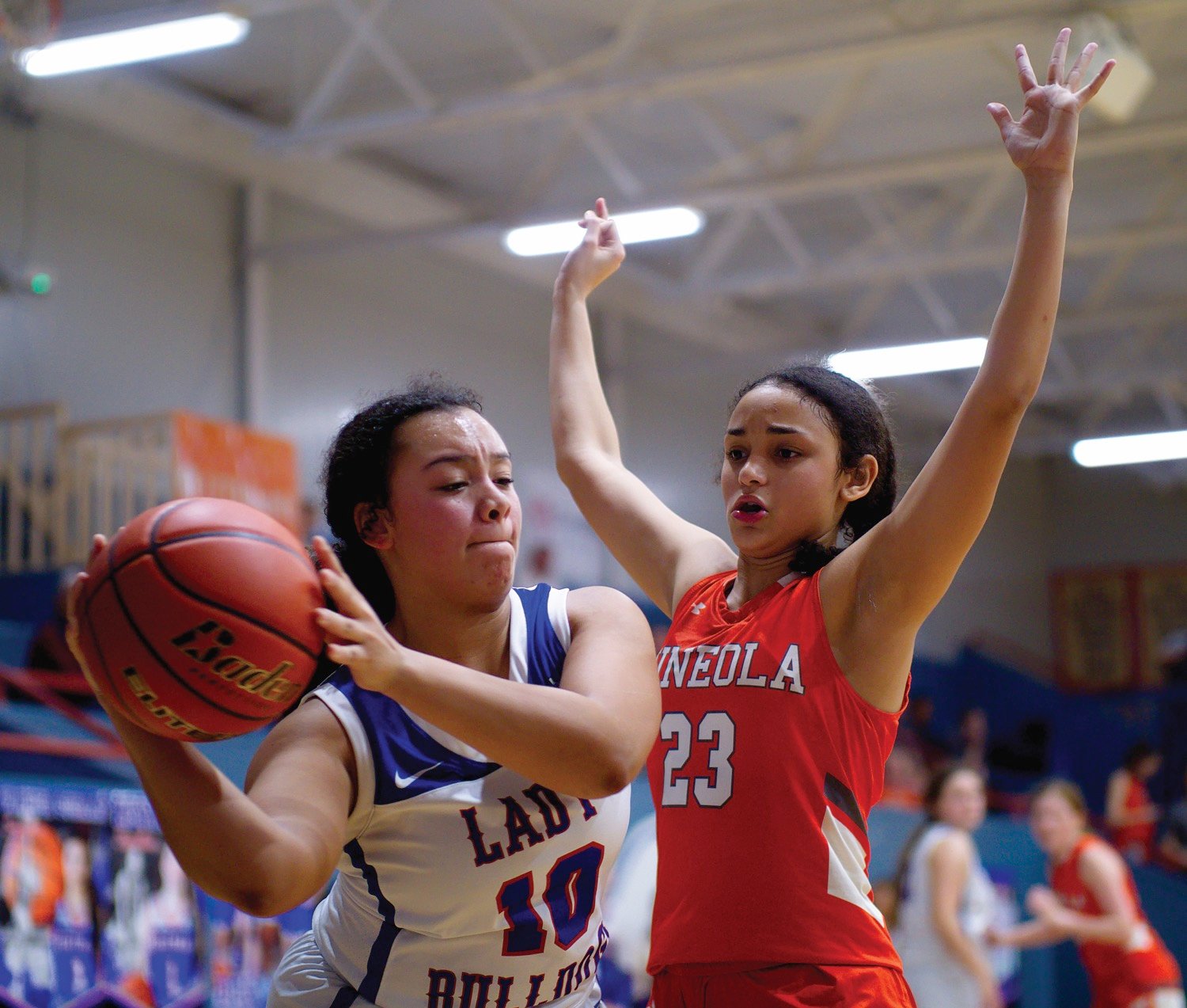 Kyra Jackson applies pressure to Ashley Davis as Mineola attempts to make a comeback in the fourth quarter. [see more shots, buy basketball photos]